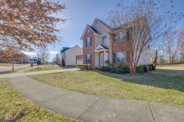 view of front facade with brick siding and a front yard