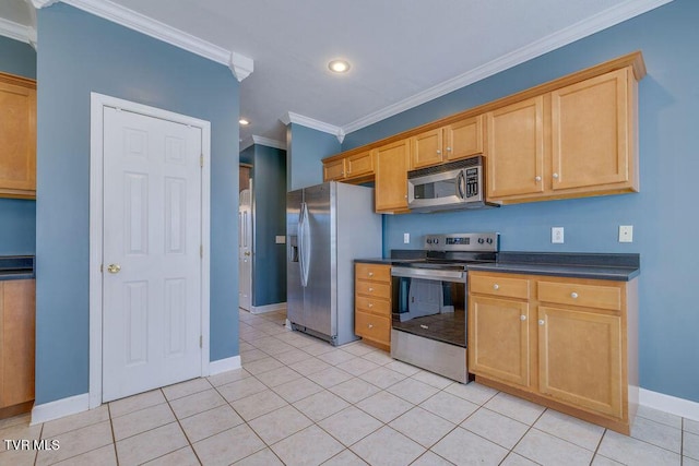 kitchen featuring dark countertops, light tile patterned floors, appliances with stainless steel finishes, and ornamental molding