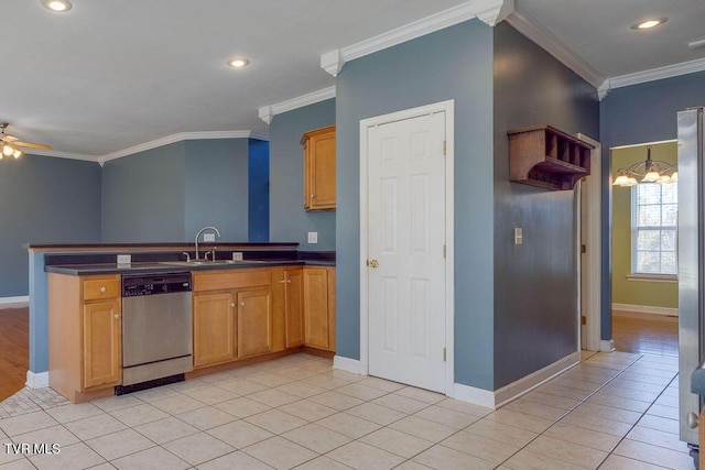 kitchen with crown molding, dark countertops, light tile patterned flooring, a sink, and dishwasher