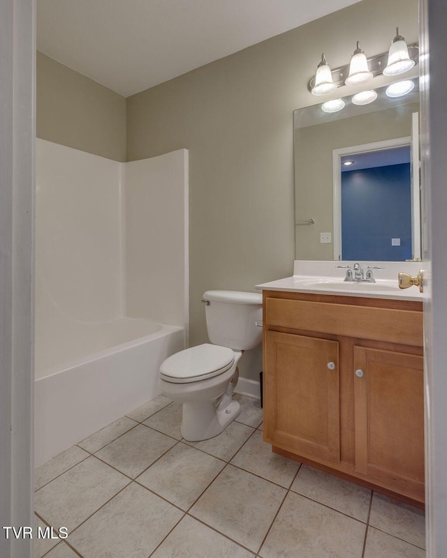 full bathroom featuring toilet, vanity, washtub / shower combination, and tile patterned floors