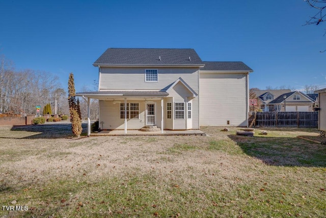 back of house featuring a patio area, a yard, and fence