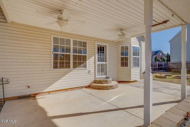 view of patio with fence and ceiling fan