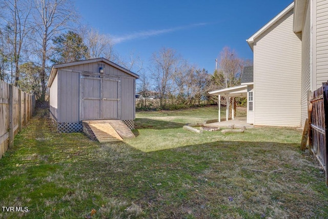 view of shed with a fenced backyard