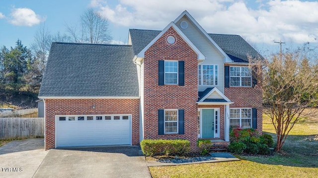 view of front of home featuring driveway, a shingled roof, and brick siding