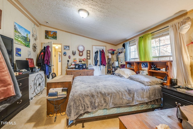 carpeted bedroom with vaulted ceiling, a textured ceiling, and crown molding