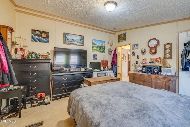 bedroom with carpet, crown molding, and a textured ceiling