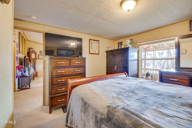 carpeted bedroom with a textured ceiling