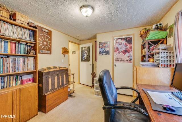 carpeted home office featuring a textured ceiling