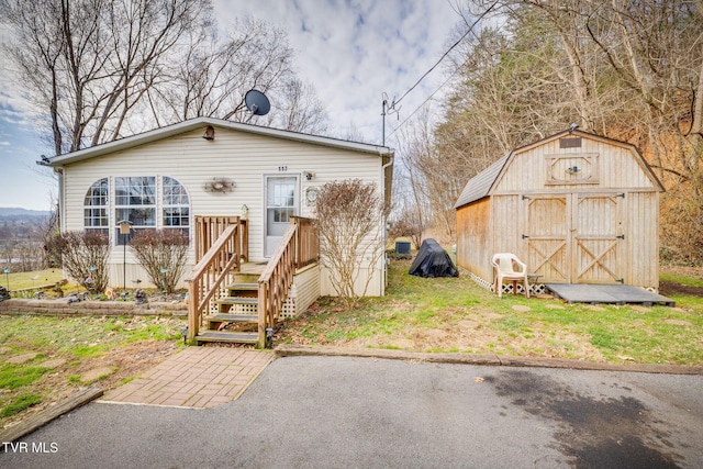 view of front facade with a shed and an outdoor structure