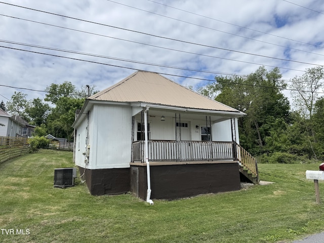736 4th St, Bristol, TN 37620 - view of front of property with covered porch, cooling unit, metal roof, and stairs
