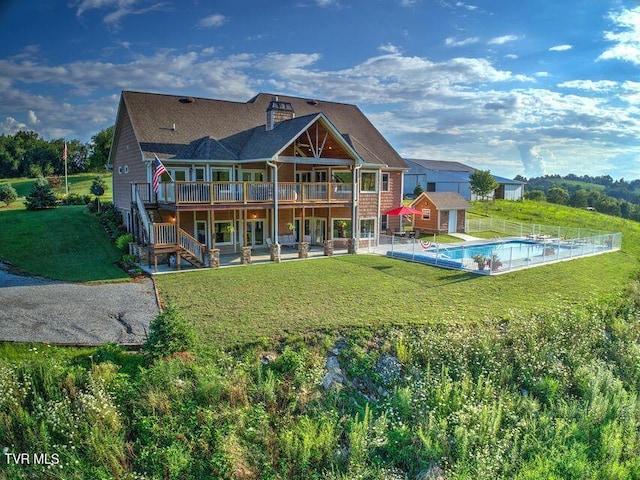 251 Fee Trl, Ewing, VA 24248 - back of property with a lawn, a patio, a chimney, stairs, and a wooden deck