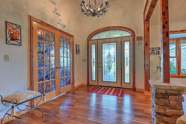 251 Fee Trl, Ewing, VA 24248 - entryway featuring french doors, baseboards, an inviting chandelier, and hardwood / wood-style flooring