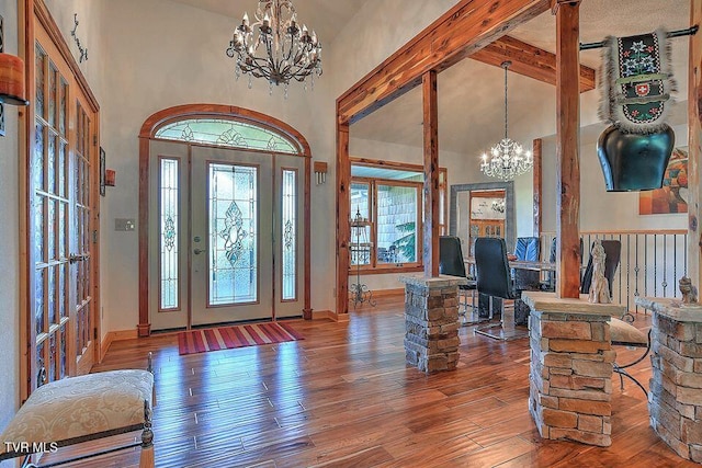 251 Fee Trl, Ewing, VA 24248 - entryway with baseboards, a chandelier, wood-type flooring, high vaulted ceiling, and beam ceiling