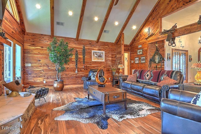 251 Fee Trl, Ewing, VA 24248 - living room featuring wood walls, beam ceiling, visible vents, and high vaulted ceiling