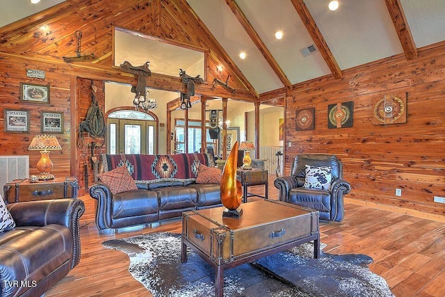 251 Fee Trl, Ewing, VA 24248 - living room with high vaulted ceiling, wood walls, beamed ceiling, and visible vents
