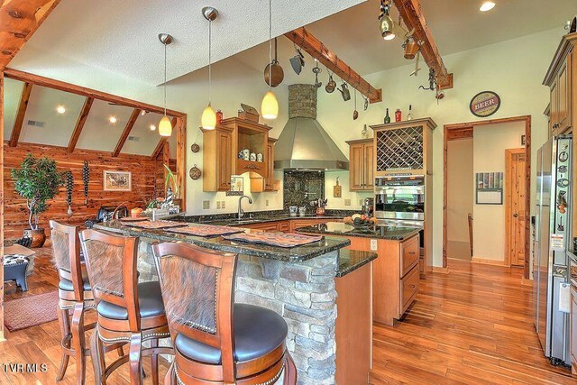 251 Fee Trl, Ewing, VA 24248 - kitchen with ventilation hood, beamed ceiling, wood finished floors, and a center island