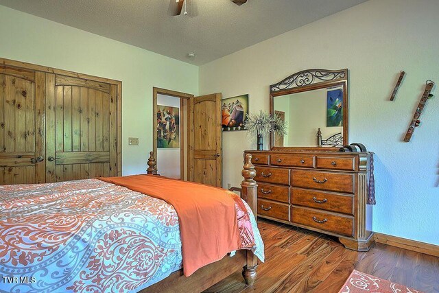251 Fee Trl, Ewing, VA 24248 - bedroom with a closet, a ceiling fan, a textured ceiling, wood finished floors, and baseboards
