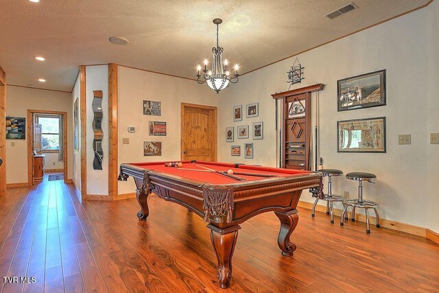 251 Fee Trl, Ewing, VA 24248 - rec room with visible vents, a textured ceiling, baseboards, and wood finished floors