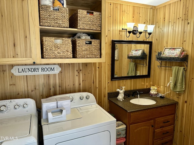 laundry room featuring laundry area, washer and clothes dryer, and a sink