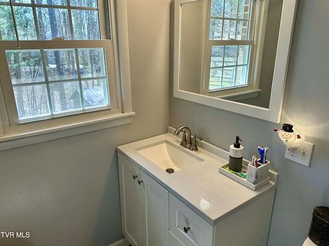 bathroom with vanity and a wealth of natural light