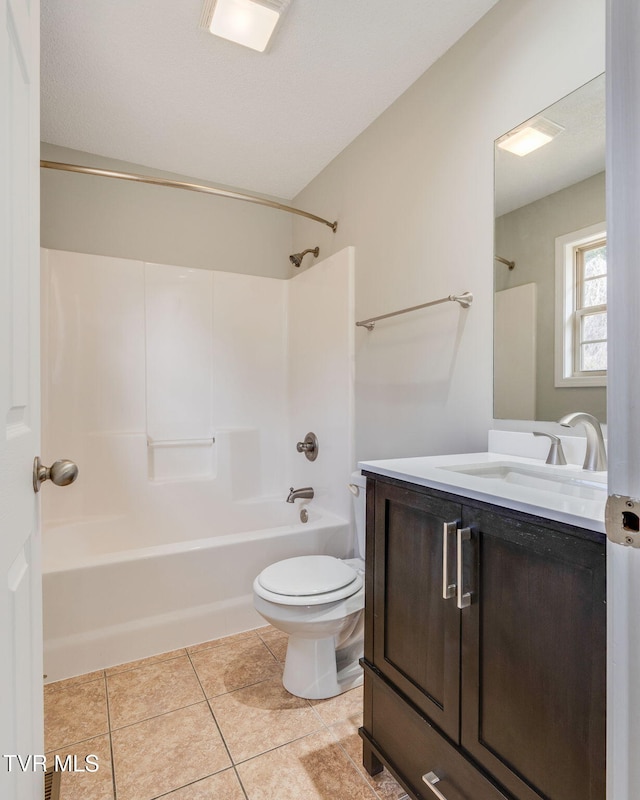 bathroom with tile patterned flooring, tub / shower combination, vanity, and toilet