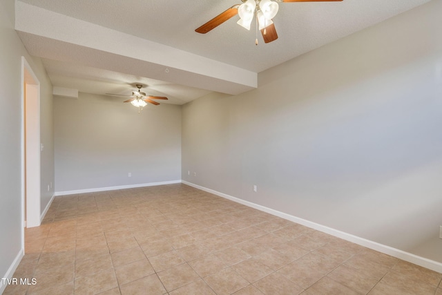 unfurnished room with ceiling fan, baseboards, and light tile patterned flooring