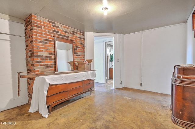 interior space with concrete floors and a textured ceiling