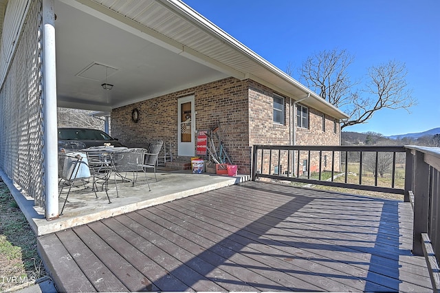 wooden deck featuring a mountain view