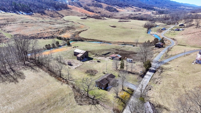 birds eye view of property featuring a rural view and a mountain view