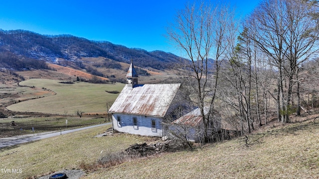 birds eye view of property with a mountain view