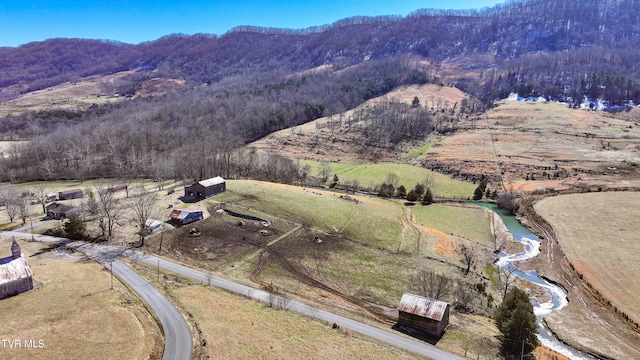 drone / aerial view with a rural view and a mountain view