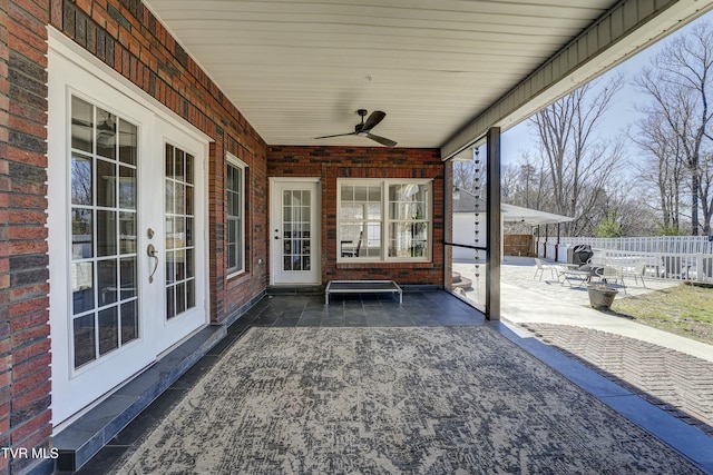 view of patio / terrace featuring french doors, a ceiling fan, and fence