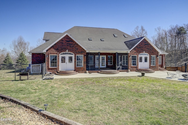 view of front of house featuring entry steps, french doors, and brick siding