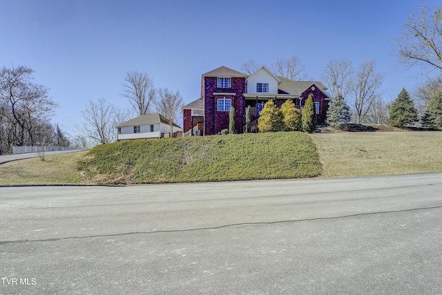 traditional-style home with brick siding