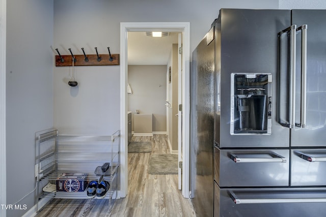 kitchen featuring high end refrigerator and wood finished floors