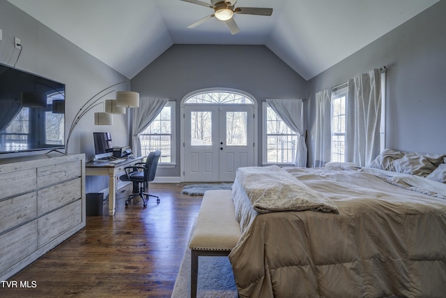 bedroom featuring a ceiling fan, vaulted ceiling, multiple windows, and dark wood-style floors