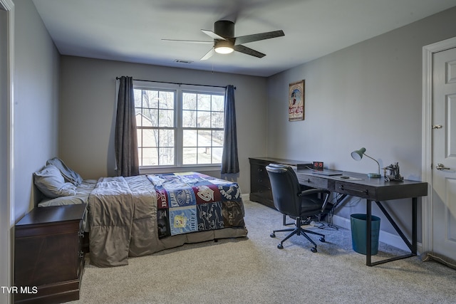 bedroom featuring visible vents, baseboards, carpet, and a ceiling fan