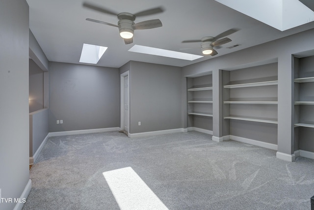 bonus room with built in features, visible vents, a skylight, and baseboards