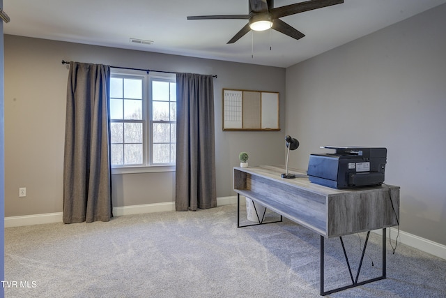 office space with visible vents, baseboards, carpet, and ceiling fan