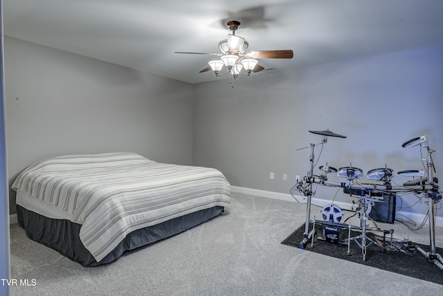 carpeted bedroom with baseboards and a ceiling fan