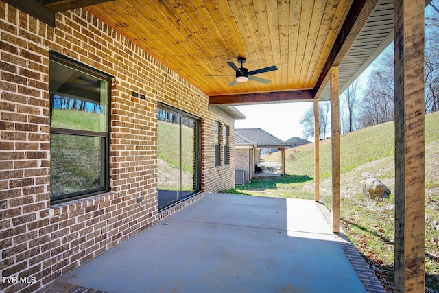 view of patio with ceiling fan and central AC