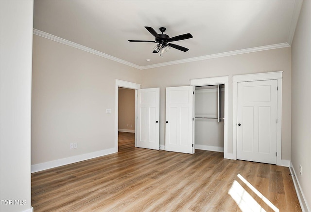 unfurnished bedroom with light wood finished floors, baseboards, a closet, and ornamental molding