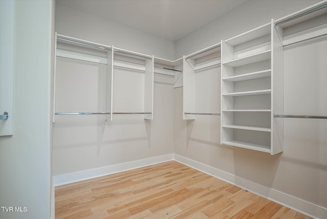 spacious closet with wood finished floors