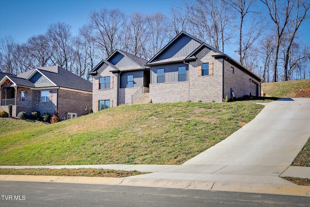 craftsman inspired home featuring a garage, brick siding, and a front lawn