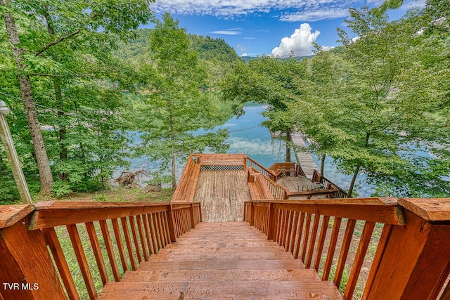 deck featuring a water view