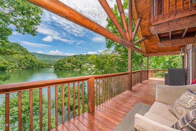 wooden terrace with a water view