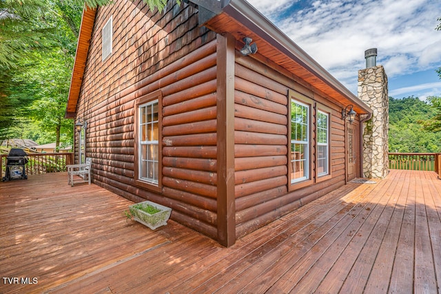 wooden terrace with grilling area