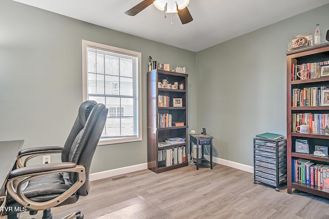 office area featuring visible vents, ceiling fan, baseboards, and wood finished floors