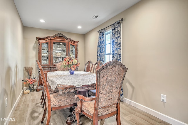 dining area with recessed lighting, baseboards, visible vents, and light wood finished floors