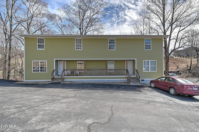 view of front of property featuring covered porch and crawl space